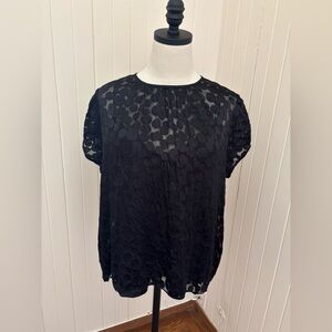 Sheer black top with circular pattern